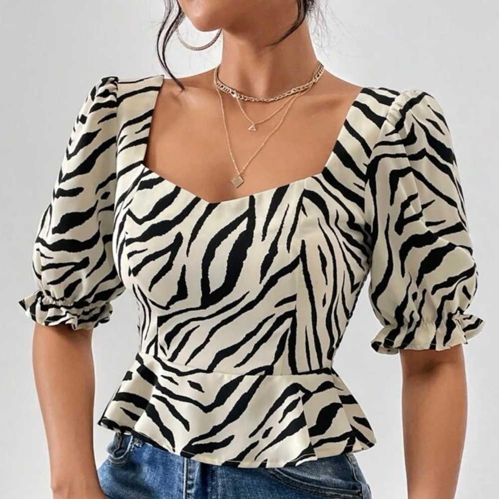 SOLD.       Zebra Striped Print Puff Sleeve Peplum Blouse